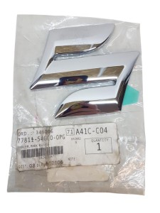 Emblemat Suzuki SX4 77811-54GC0-OPG Nowy Oryginał OE